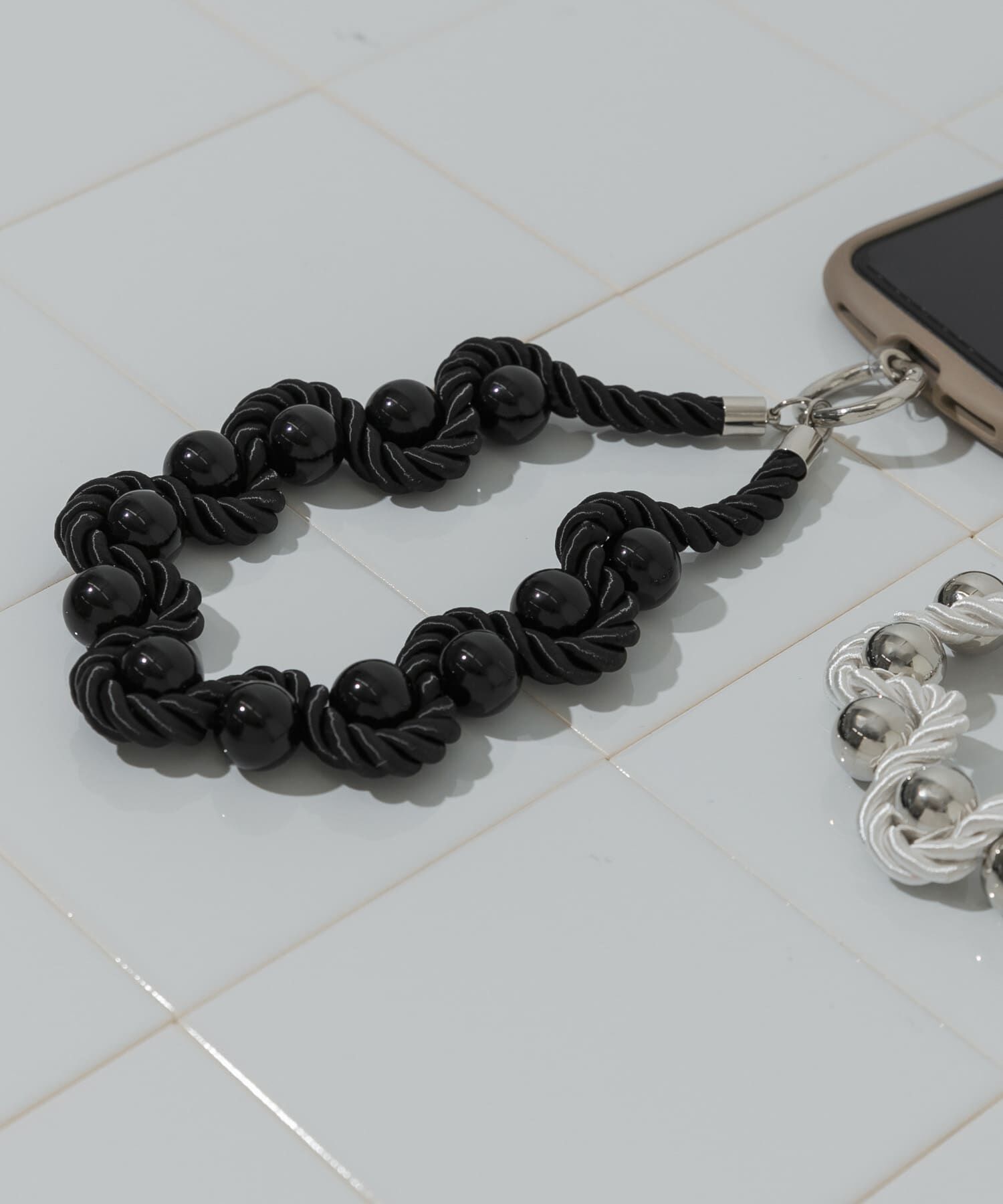 SMELLY「ツイストロープボールハンドストラップ」|モバイルケース|