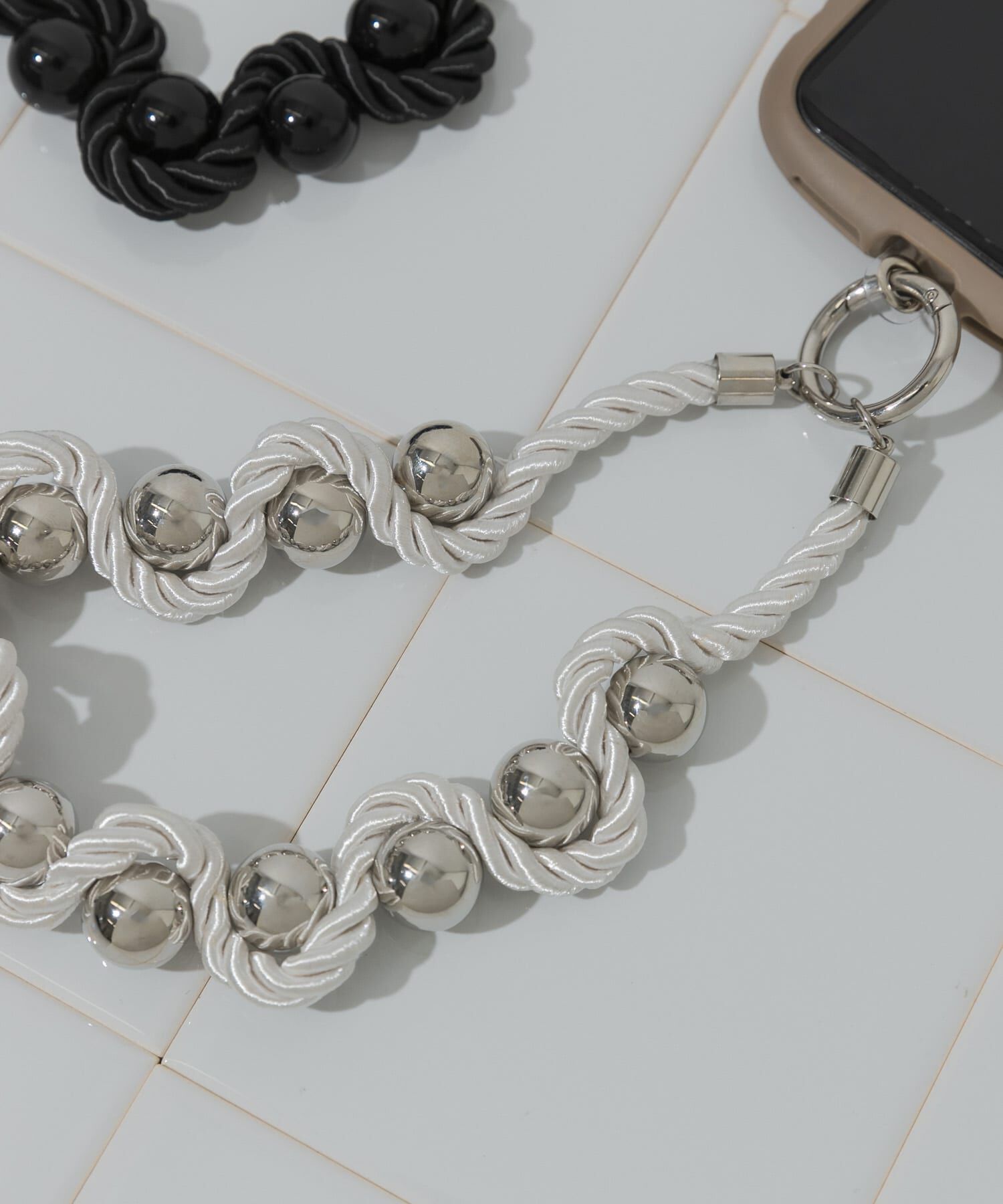 SMELLY「ツイストロープボールハンドストラップ」|モバイルケース|