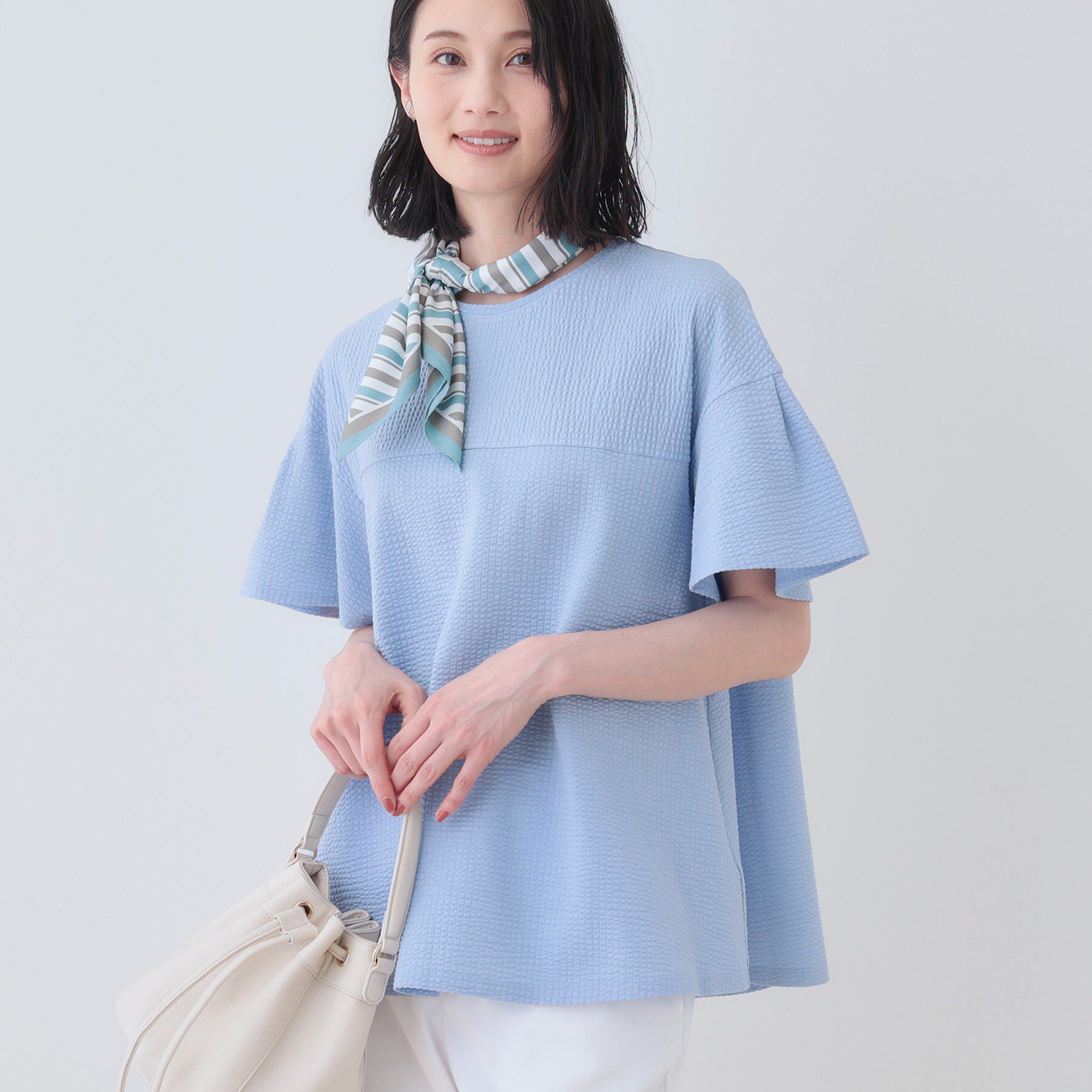 INDIVI「【洗える／体型カバー】凹凸素材フレアデザイントップス」|Tシャツ・カットソー|