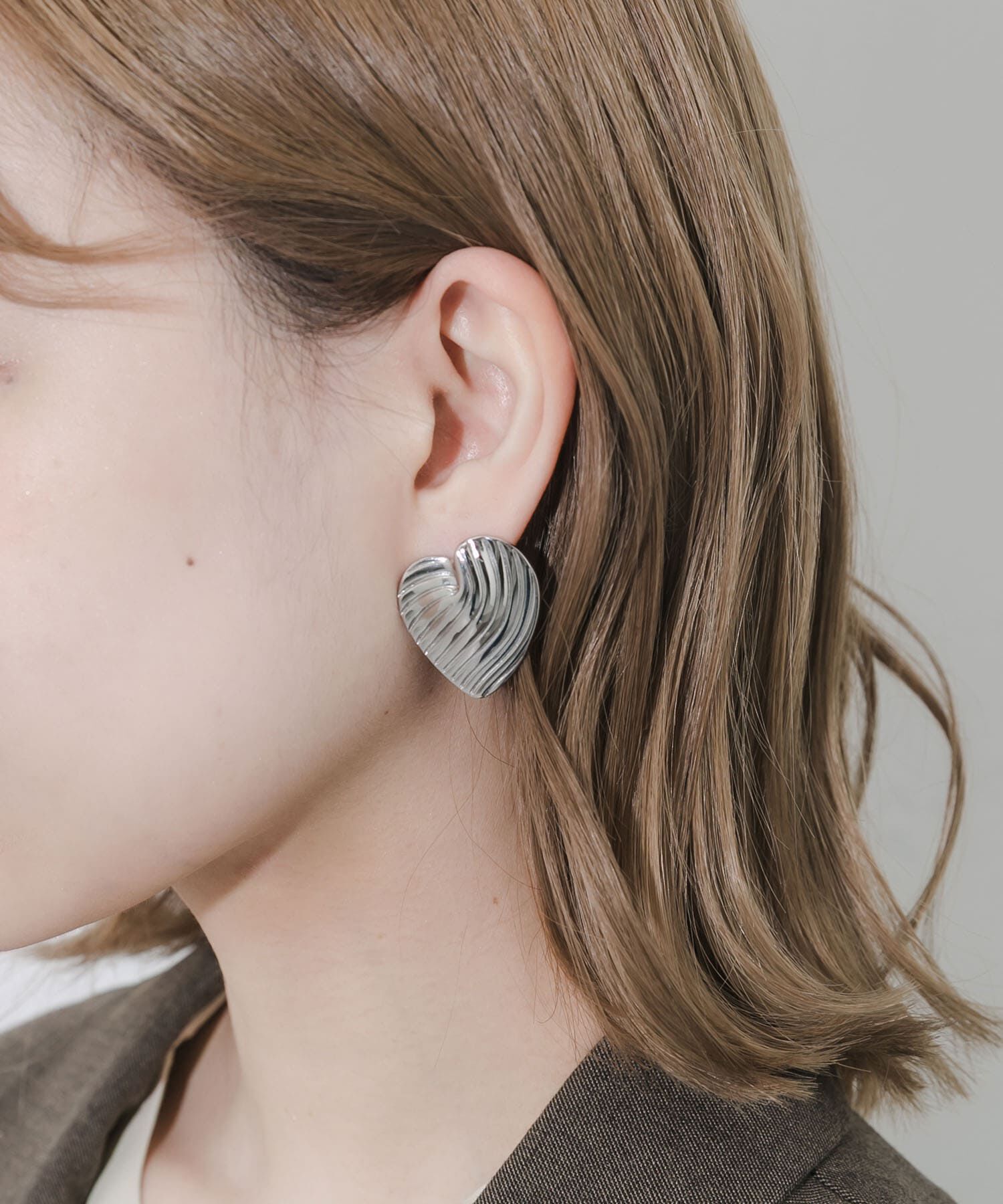 SMELLY「ステンレスウェーブラインハートピアス」|ピアス|シルバー