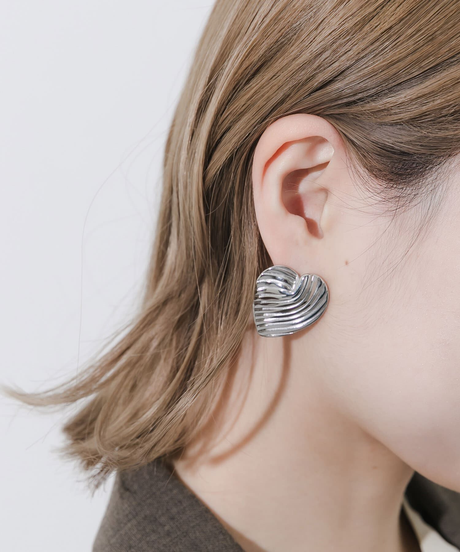 SMELLY「ステンレスウェーブラインハートピアス」|ピアス|