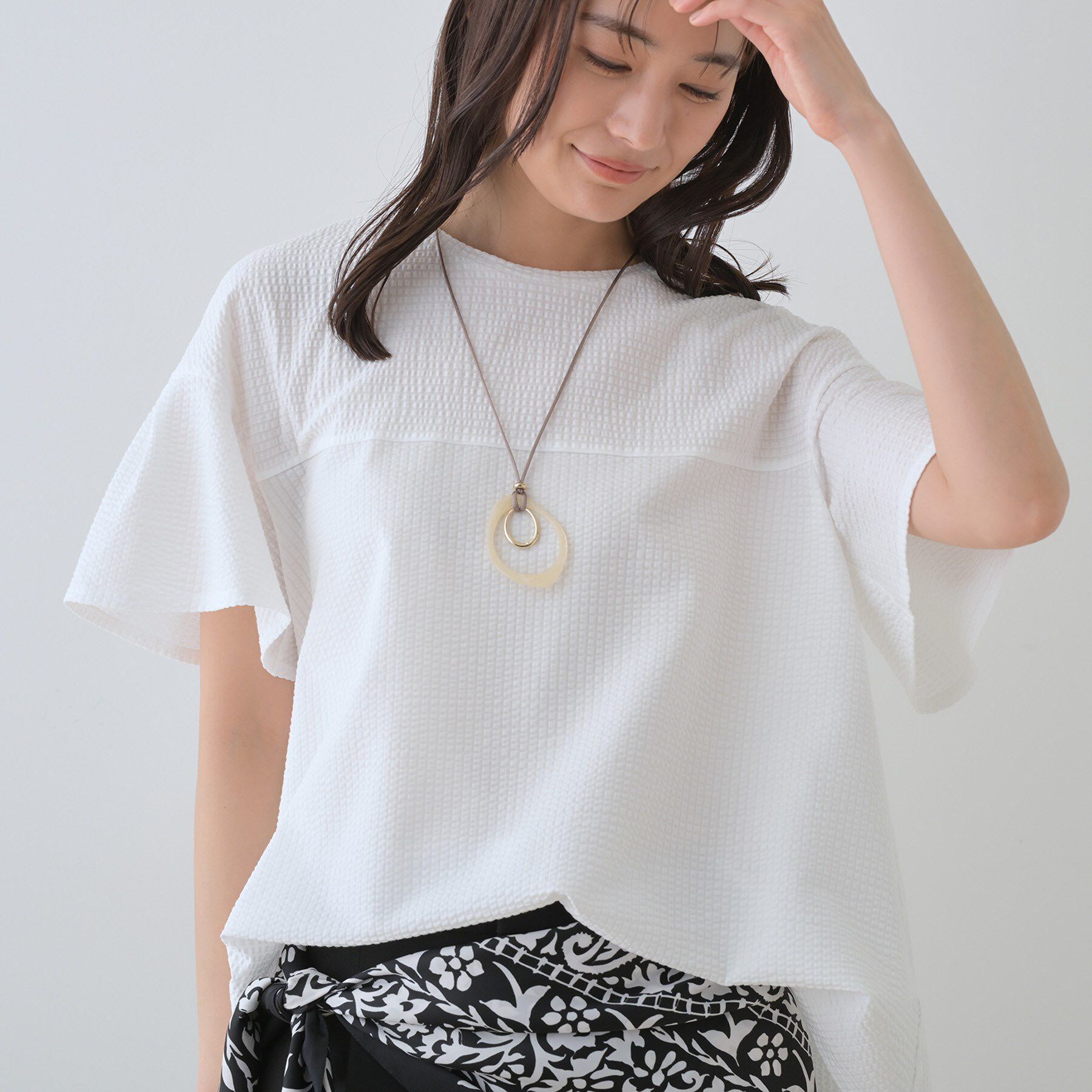 INDIVI「【洗える／体型カバー】凹凸素材フレアデザイントップス」|Tシャツ・カットソー|ホワイト(001)