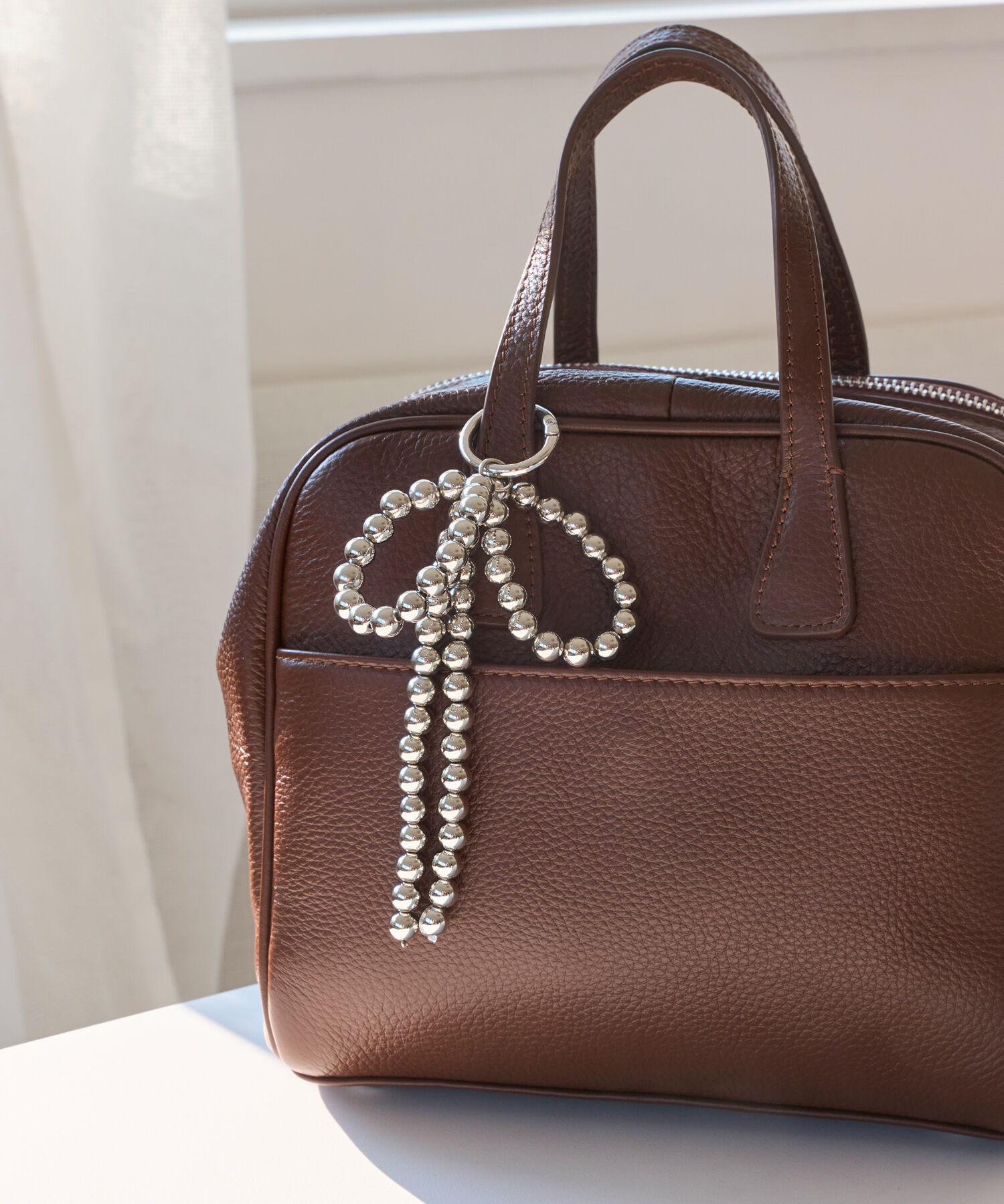 Phoebe「シルバーボールリボンバッグチャーム」|チャーム・キーホルダー|シルバー