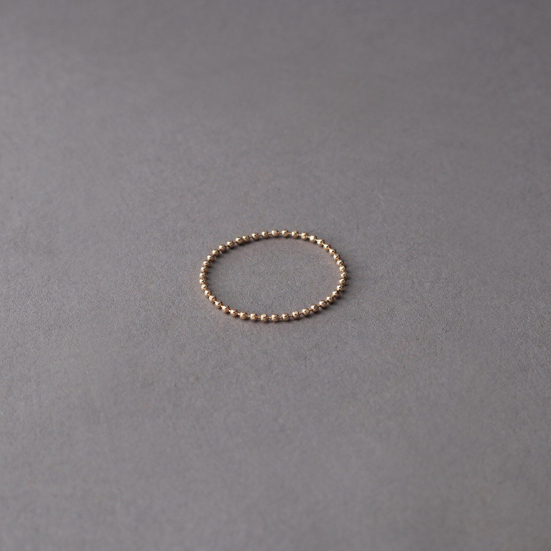 COCOSHNIK ONKITSCH「K10スキニーリング カットボール」|リング|イエローゴールド(1