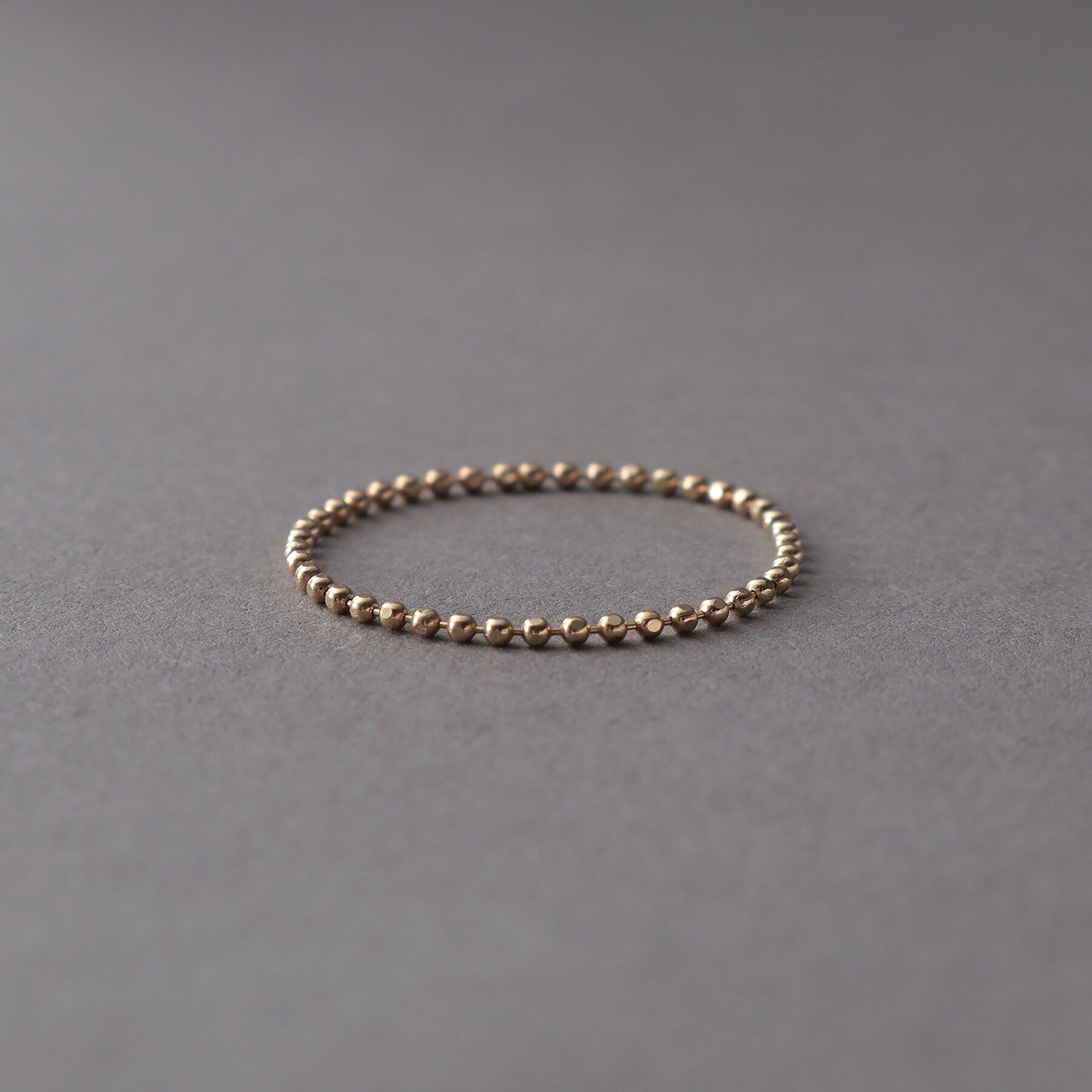 COCOSHNIK ONKITSCH「K10スキニーリング カットボール」|リング|