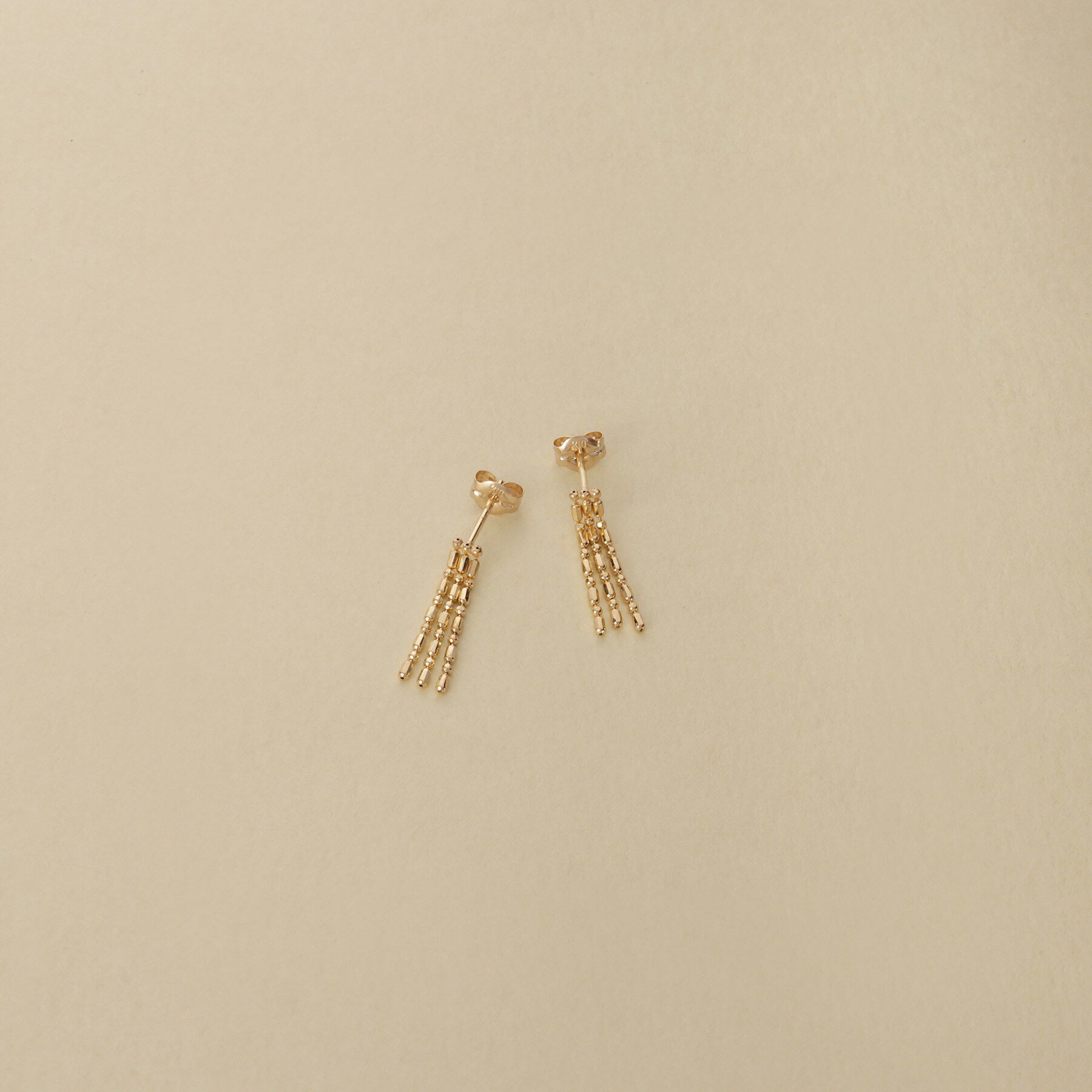 COCOSHNIK ONKITSCH「K10シリンダーチェーン フリンジピアス」|ピアス|