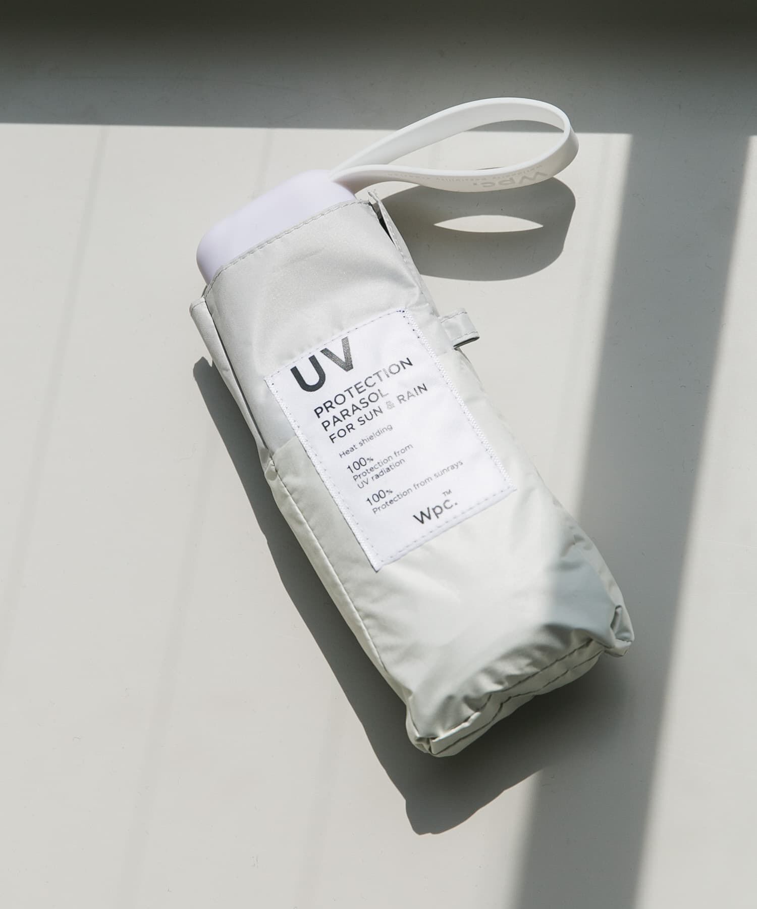 SMELLY「Wpc.　UV100%折り畳み傘」|傘|オフホワイト