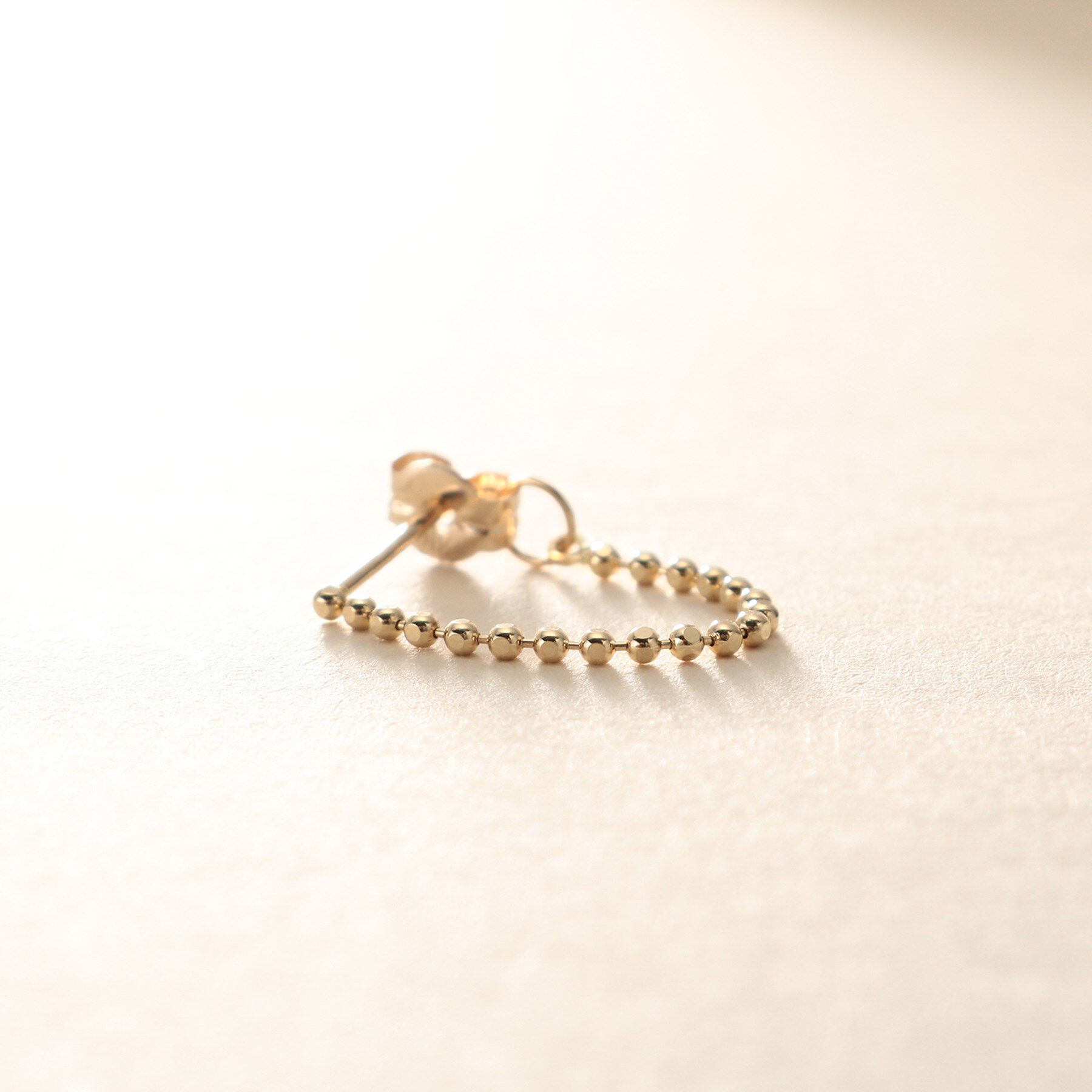 COCOSHNIK ONKITSCH「K10カットボールチェーン フープピアス」|ピアス|