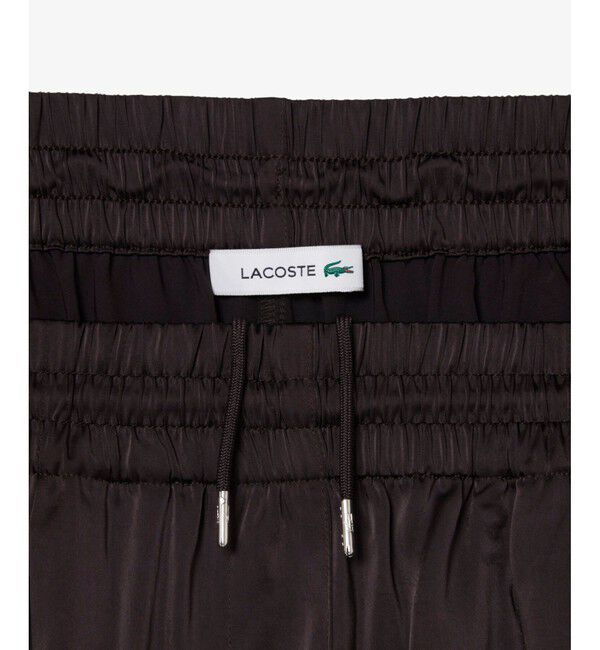 LACOSTE「オーバーサイズイージーサテンドレープフレアパンツ / ワイドタックパンツ」|サルエル|